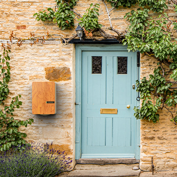 Sleek Andersen A3 home EV charger installed beside a front door