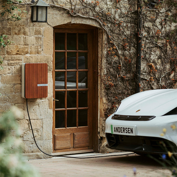 Andersen A2 home EV charger installed beside a premium electric vehicle